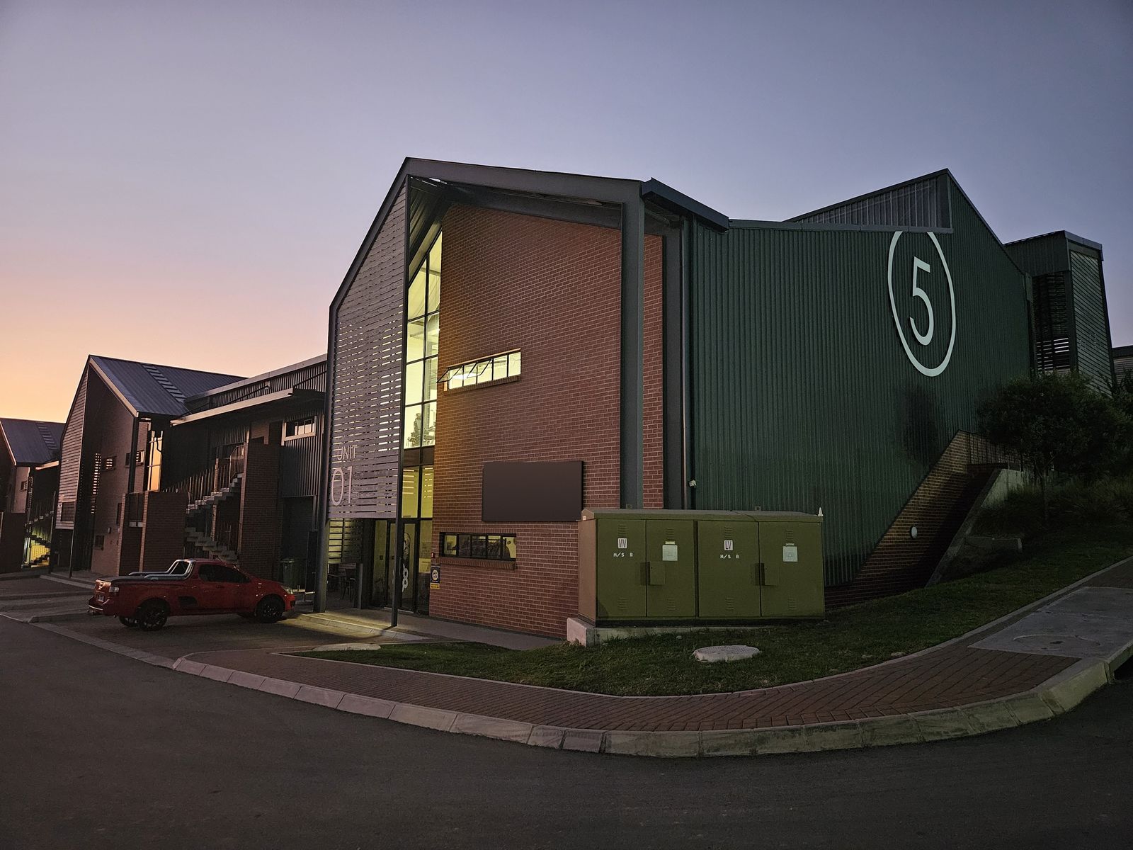 The CCS Apparel factory at Riversands Outlet Park at dusk