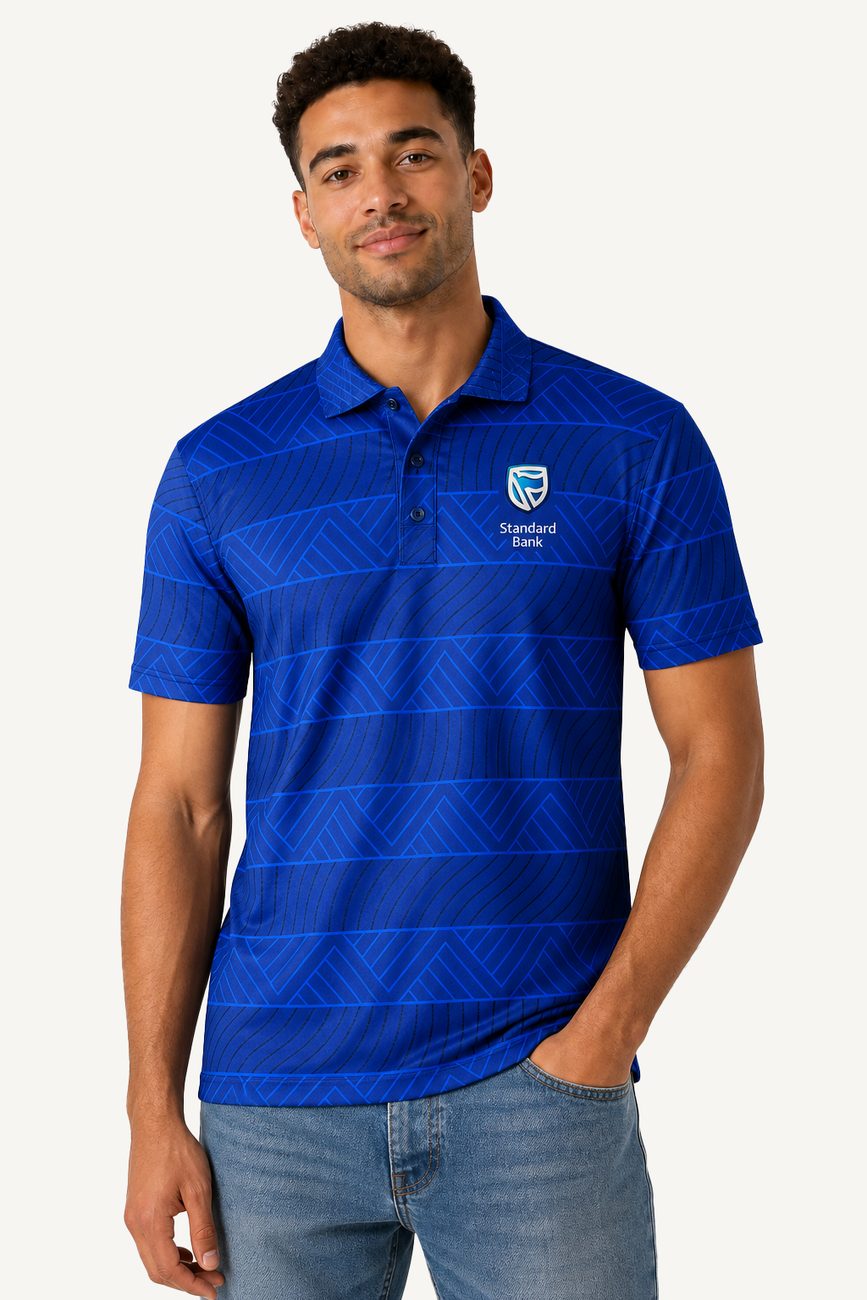 A man in a blue Standard Bank polo with a subtle geometric pattern